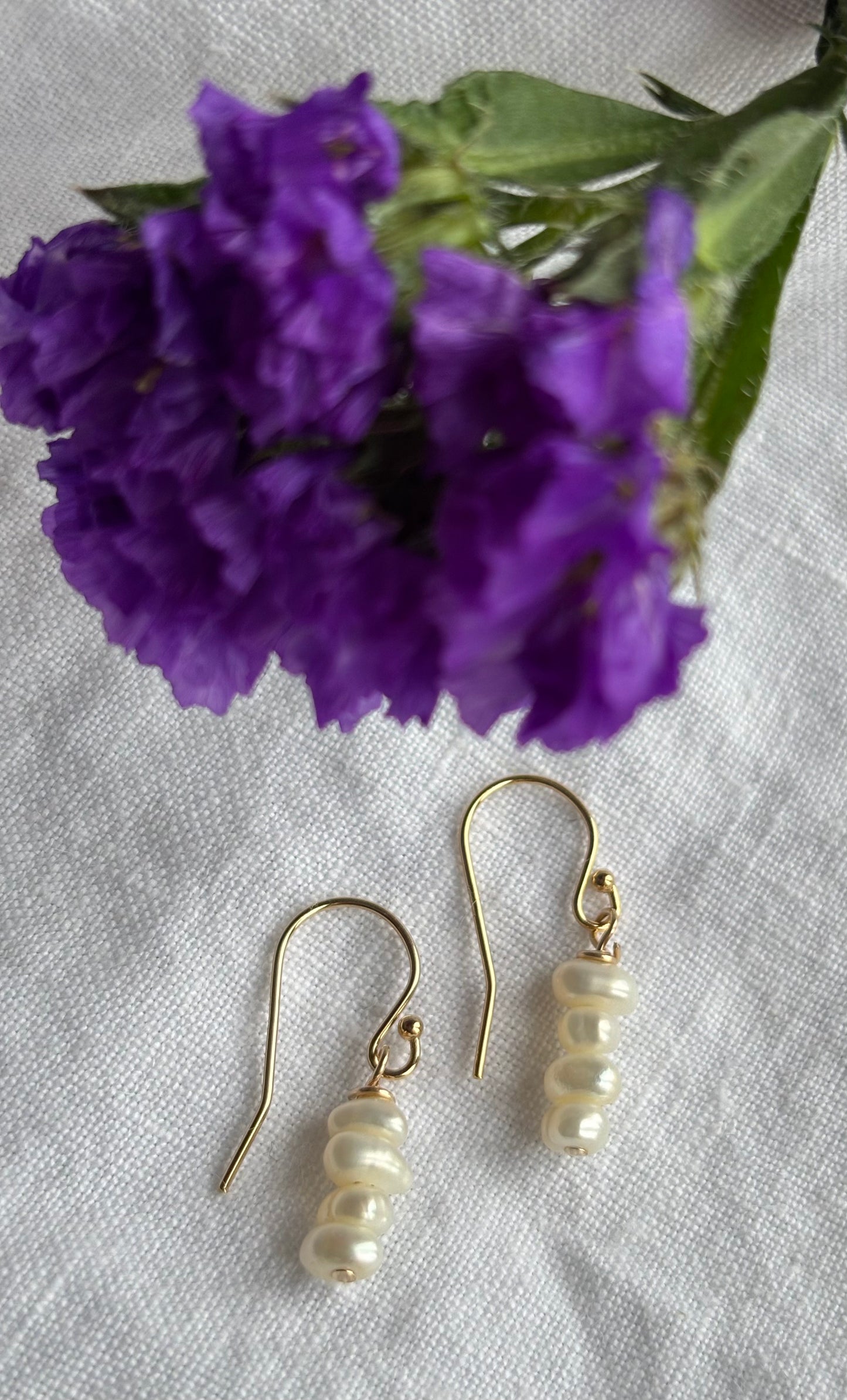 14K gold filled shepherd’s crook earring featuring white seed freshwater pearls