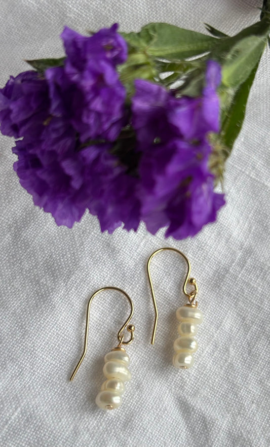14K gold filled shepherd’s crook earring featuring white seed freshwater pearls