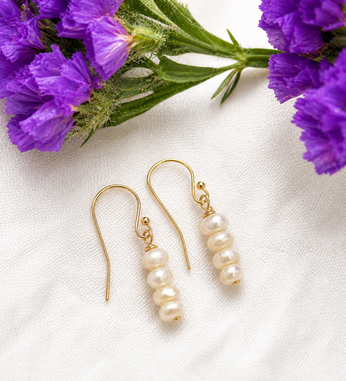 14K Gold Filled shepherd’s crook earring featuring white seed Freshwater Pearls