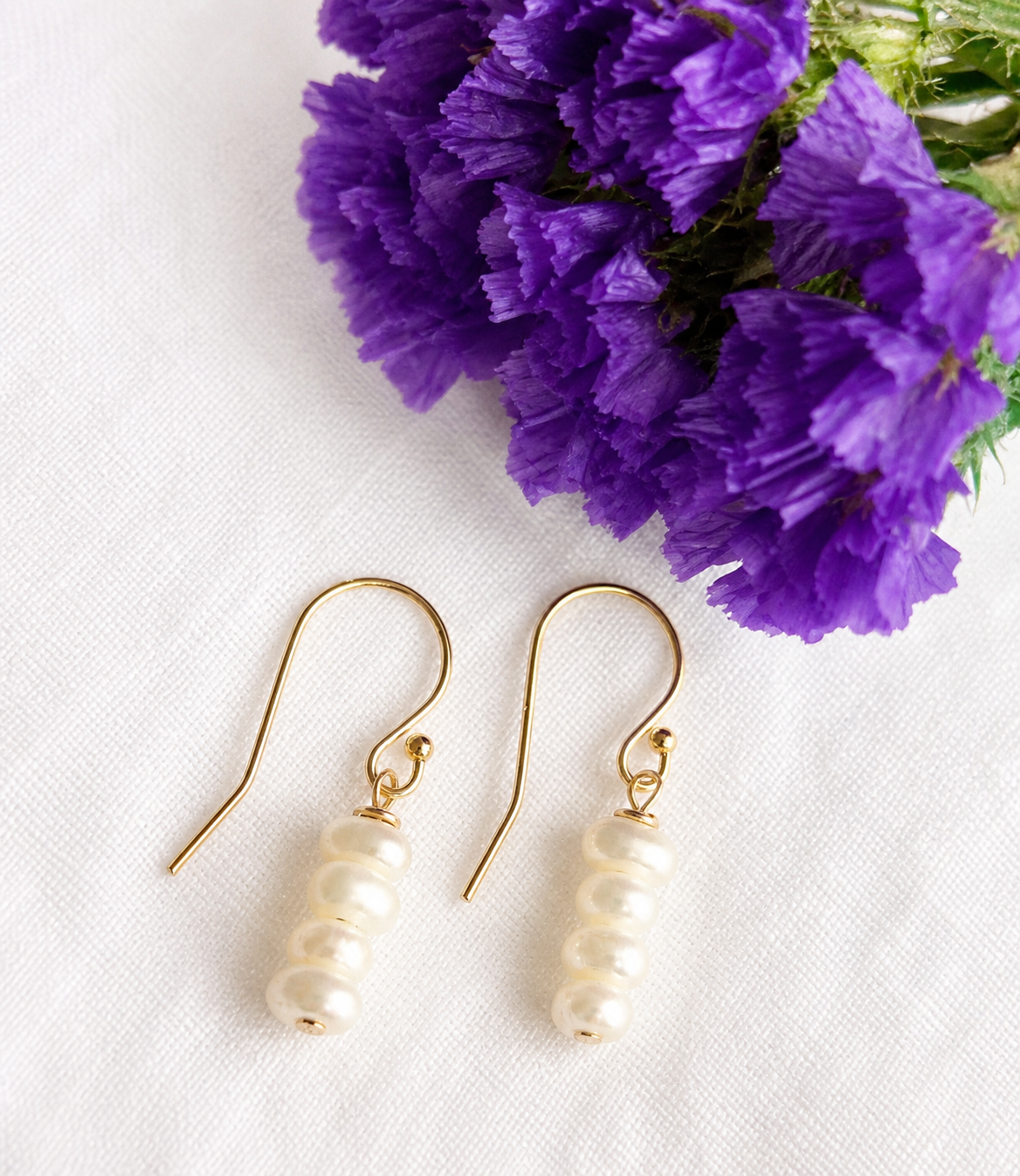 14K Gold Filled shepherd’s crook earring featuring white seed Freshwater Pearls